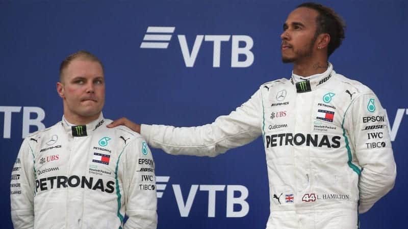 SOCHI, RUSSIA SEPTEMBER 30, 2018: Mercedes AMG Petronas drivers Valtteri Bottas (L) of Finland, second-placed, and Lewis Hamilton (L-R) of the United Kingdom, first-placed, attend the 2018 Formula One Russian Grand Prix awarding ceremony at the Sochi Autodrom racing circuit. Yegor Aleyev/TASS (Photo by Yegor Aleyev\TASS via Getty Images)