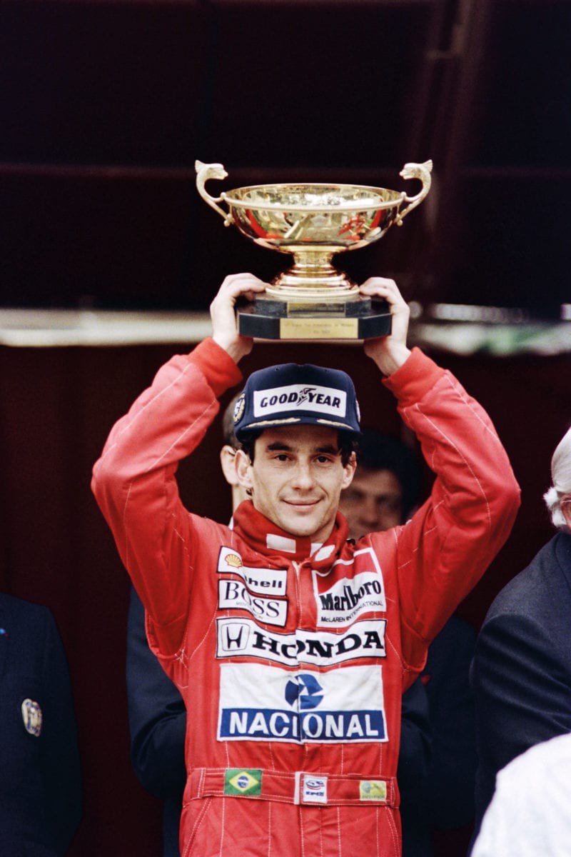 Ayrton Senna lifts the winner's trophy at the 1989 Monaco Grand Prix