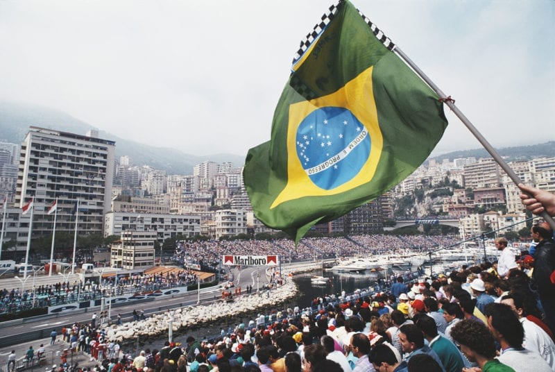 Brazilian flag waves as Ayrton Senna drives to victory in the 19189 Monaco Grand Prix
