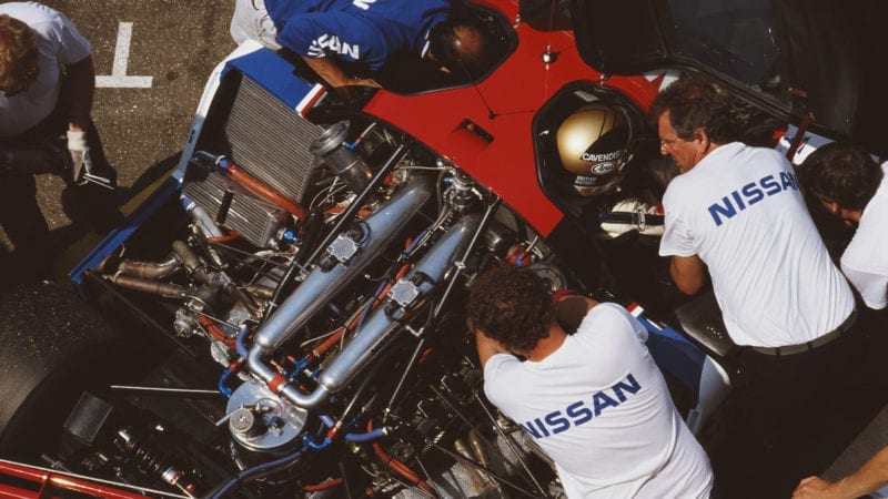 Team Manager Keith Greene talks to Julian Bailey (in car) of Great Britain, driver of the #23 Nissan Motorsports International Nissan R89C during the FIA World Sportscar Prototype Championship Coupe de Dijon on 21st May 1989 at the Circuit Dijon Prenois in Dijon, France.(Photo by Pascal Rondeau/Getty Images)