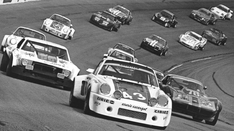 DAYTONA BEACH, FL — February 5, 1977: From 12th on the grid, the No. 43 Porsche 911 Carrera RSR of Dave Helmick, Hurley Haywood and John Graves gets set for the start of the 24 Hour Pepsi Challenge at Daytona International Speedway. The team would go on to win the race. (Photo by ISC Images & Archives via Getty Images)