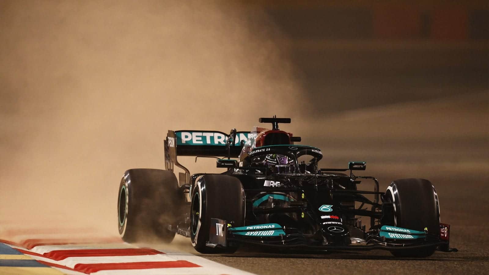 Lewis Hamilton kicks up sand in Bahrain