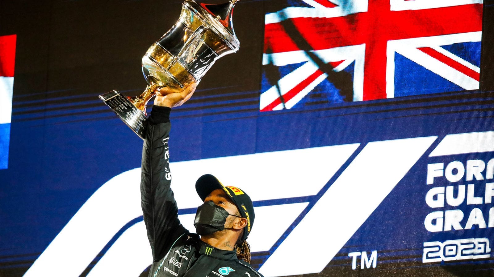 Lewis Hamilton lifts the winners trophy from the 2021 Bahrain Grand Prix
