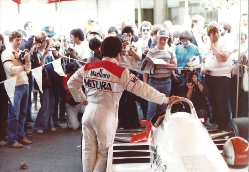 Mario Andretti surrounded by fans at the 1981 US Grand Prix