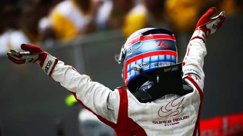 Japanese Super Aguri Formula One driver Takuma Sato celebrates in Parc Fermé finishing in eight position driving his Super Aguri SA07 at the 2007 Spanish Grand Prix at the Circuit de Barcelona-Catalunya on the 13 May 2007 (Photo by Darren Heath/Getty Images)
