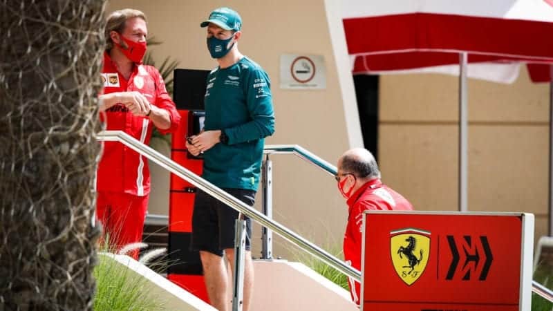 Sebastian Vettel speaks to Ferrari team members at the 2021 Bahrain Grand Prix