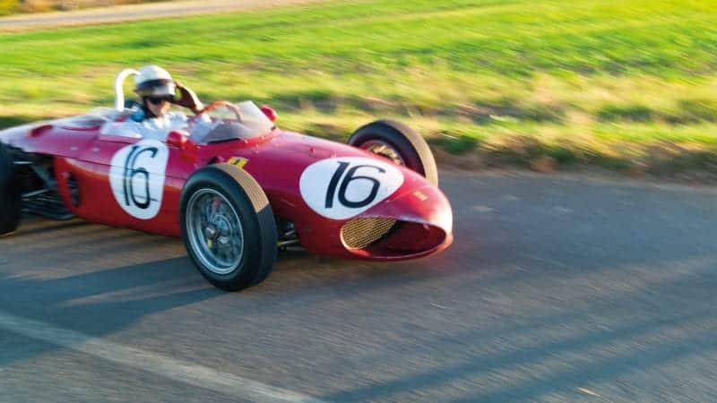 Blurred shot of Derek Hill driving Sharknose Ferrari