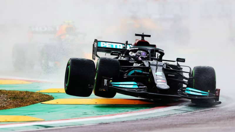 Lewis Hamilton crashes down onto a kerb at the start of the 2021 Emilia Romagna Grand Prix