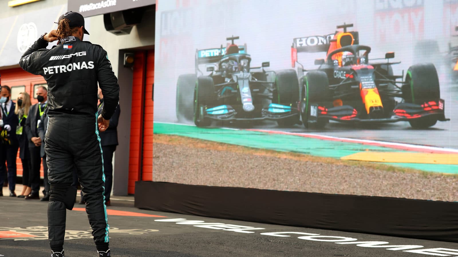 Lewis Hamilton watches his fight with Max Verstappen at the 2021 Emilia Romagna Grand Prix