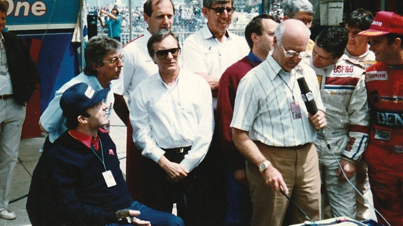 Murray Walker cutting a cake at Monaco 1988