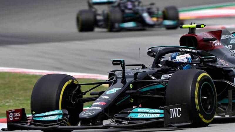 Mercedes' Finnish driver Valtteri Bottas drives ahead of Mercedes' British driver Lewis Hamilton during the Spanish Formula One Grand Prix race at the Circuit de Catalunya on May 9, 2021 in Montmelo on the outskirts of Barcelona. (Photo by JAVIER SORIANO / AFP) (Photo by JAVIER SORIANO/AFP via Getty Images)