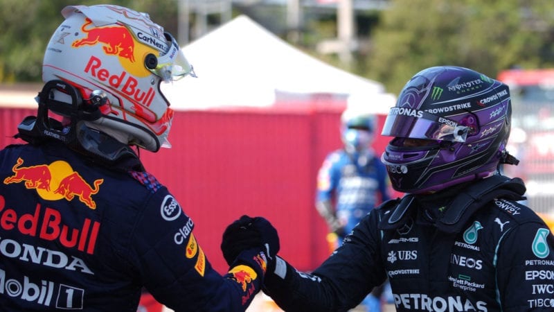 Mercedes' British driver Lewis Hamilton (R) shakes hands with Red Bull's Dutch driver Max Verstappen after the qualifying session at the Circuit de Catalunya on May 8, 2021 in Montmelo on the outskirts of Barcelona ahead of the Spanish Formula One Grand Prix. (Photo by Emilio Morenatti / POOL / AFP) (Photo by EMILIO MORENATTI/POOL/AFP via Getty Images)