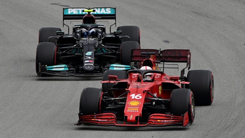 Ferrari's Monegasque driver Charles Leclerc drives ahead of Mercedes' Finnish driver Valtteri Bottas during the Spanish Formula One Grand Prix race at the Circuit de Catalunya on May 9, 2021 in Montmelo on the outskirts of Barcelona. (Photo by JAVIER SORIANO / AFP) (Photo by JAVIER SORIANO/AFP via Getty Images)
