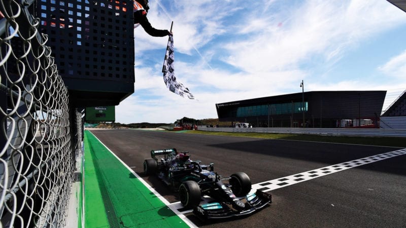 Lewis Hamilton crosses the finish line to win the 2021 Portuguese Grand Prix