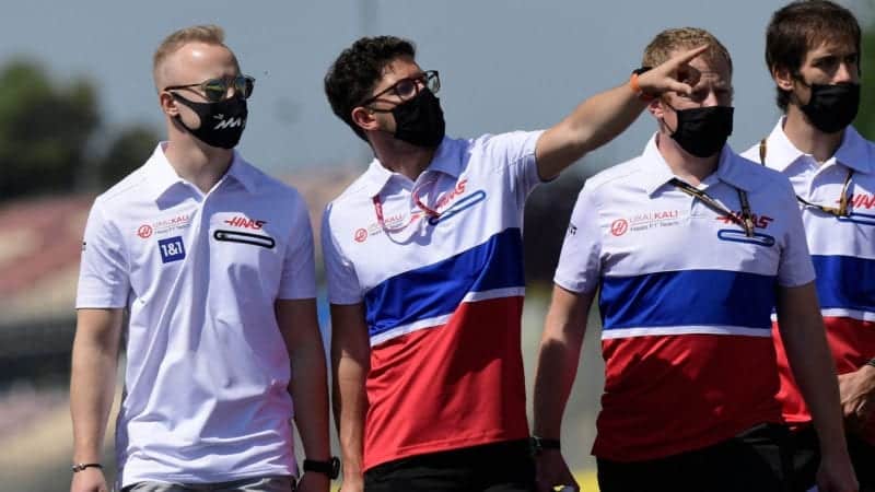 Haas F1's Russian driver Nikita Mazepin (L) and his team check the Circuit de Catalunya on May 6, 2021 in Montmelo on the outskirts of Barcelona, ahead of the Spanish Formula One Grand Prix. (Photo by JAVIER SORIANO / AFP) (Photo by JAVIER SORIANO/AFP via Getty Images)