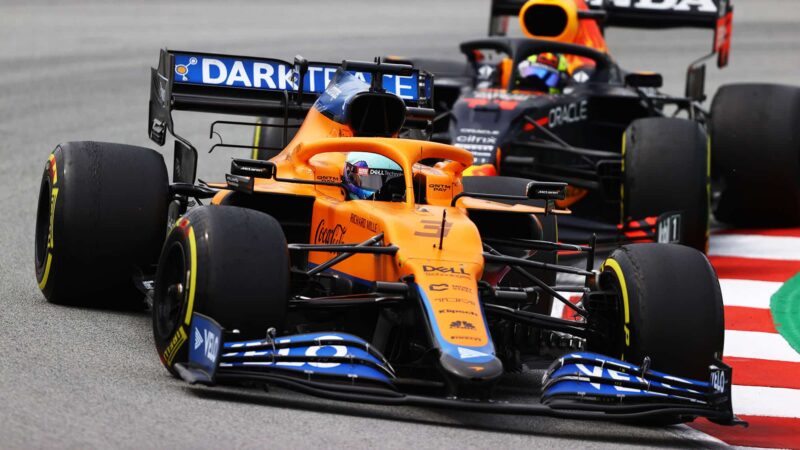 BARCELONA, SPAIN - MAY 09: Daniel Ricciardo of Australia driving the (3) McLaren F1 Team MCL35M Mercedes leads Sergio Perez of Mexico driving the (11) Red Bull Racing RB16B Honda during the F1 Grand Prix of Spain at Circuit de Barcelona-Catalunya on May 09, 2021 in Barcelona, Spain. (Photo by Bryn Lennon/Getty Images)