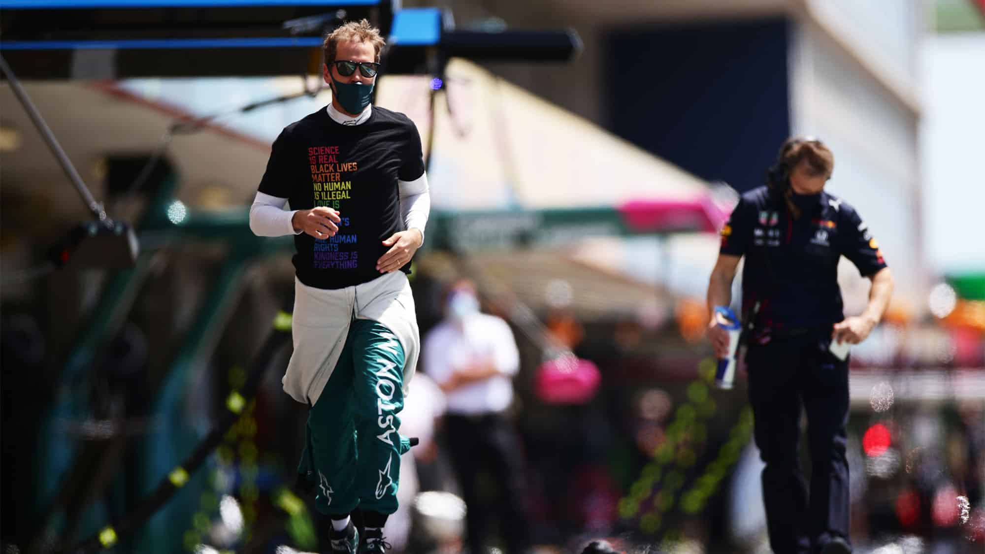 PORTIMAO, PORTUGAL - MAY 02: Sebastian Vettel of Germany and Aston Martin F1 Team runs to the grid during the F1 Grand Prix of Portugal at Autodromo Internacional Do Algarve on May 02, 2021 in Portimao, Portugal. (Photo by Peter Fox/Getty Images)