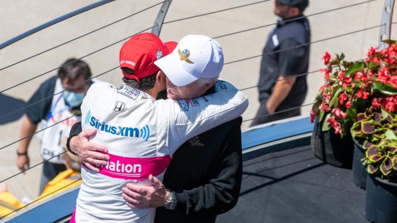 Helio Castroneves embraces Roger Penske after the 2021 Indy 500