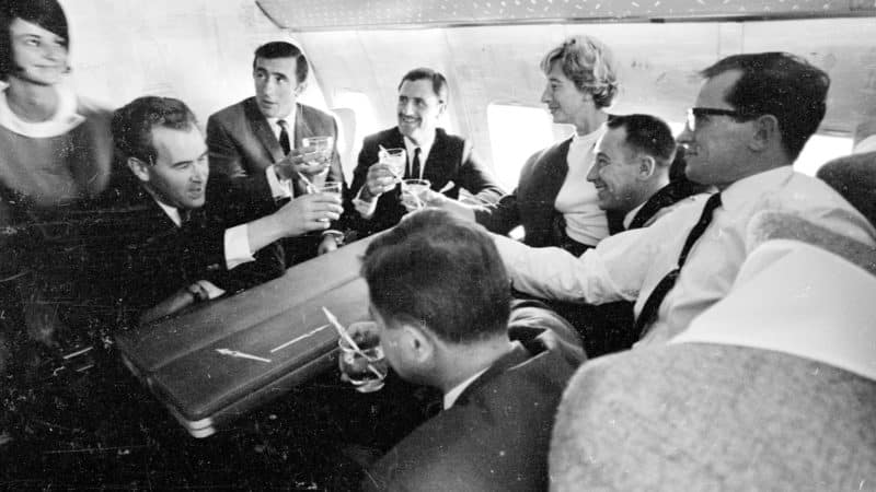 Jackie Stewart Graham Hill and others on a plane to 1966 Indy 500