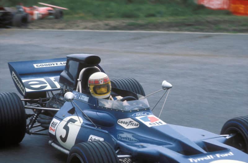 Jackie Stewart passes the crashed car of Nanni Galli at the 1971 Dutch GP