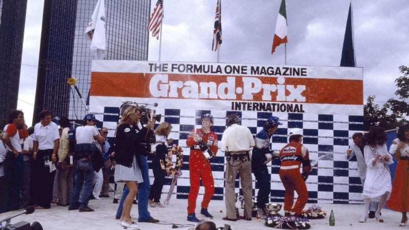 John Watson on the podium after winning the 1982 Detroit GP