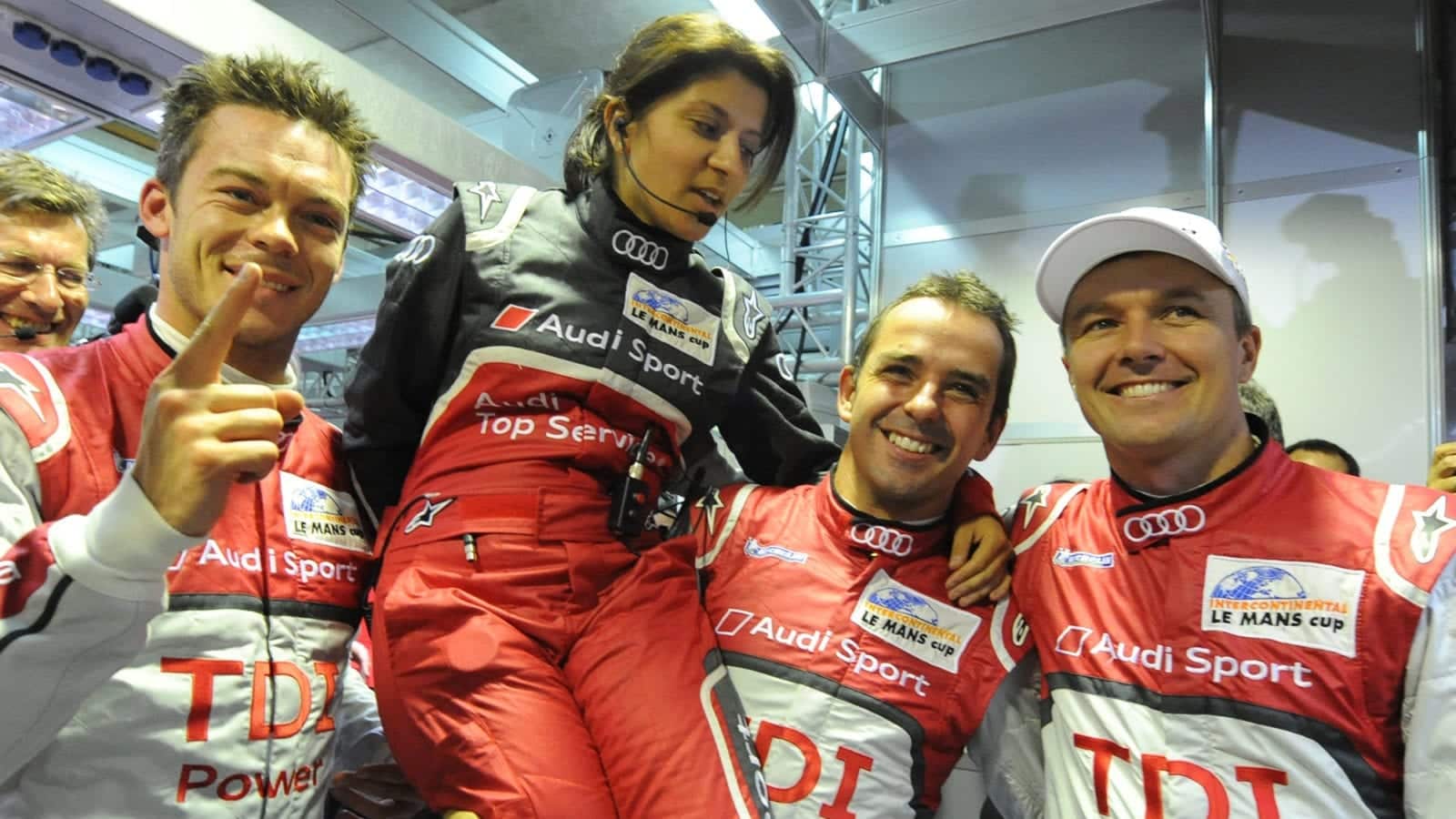 Leena Gade is lifted up by her Audi drivers after clinching pole in the 2011 Le Mans 24 Hours