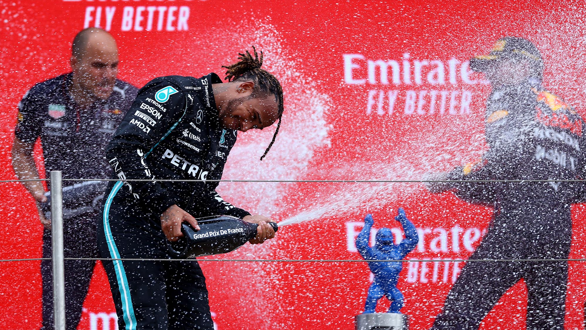 Lewis Hamilton and Max Verstappen spray champ[agne on the podium at the 2021 French Grand Prix