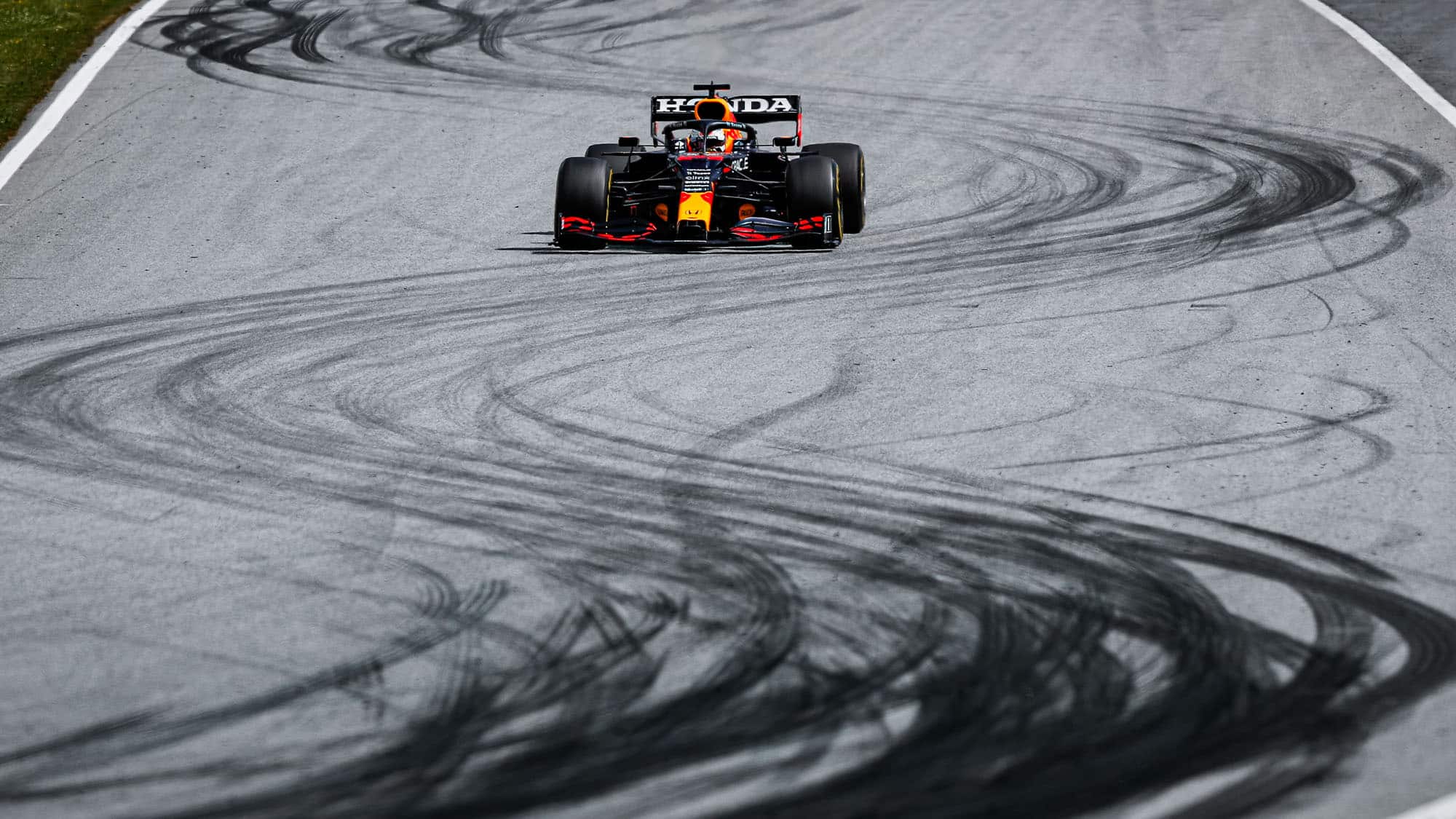 Max Verstappen drives over tyre marks at the 2021 Styrian Grand Prix