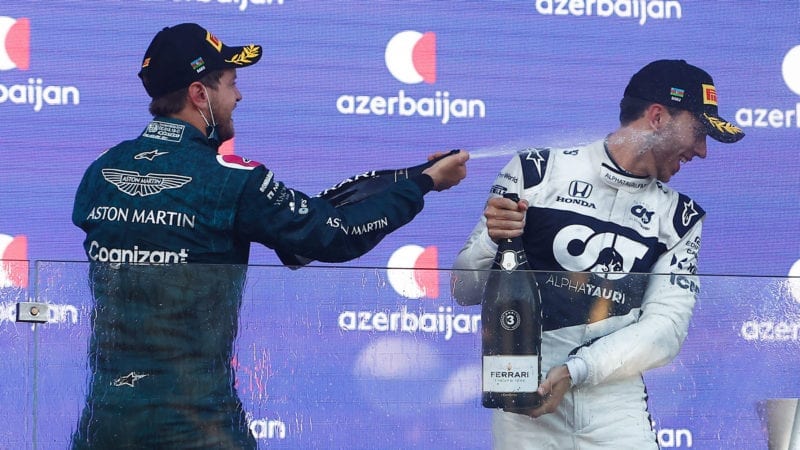 Sebastian Vettel and Pierre Gasly spray champagne after the 2021 Azerbaijan Grand Prix