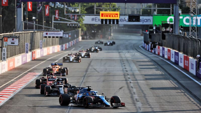 Fernando Alonso leads a line of cars at the 2021 Azerbaijan Grand Prix