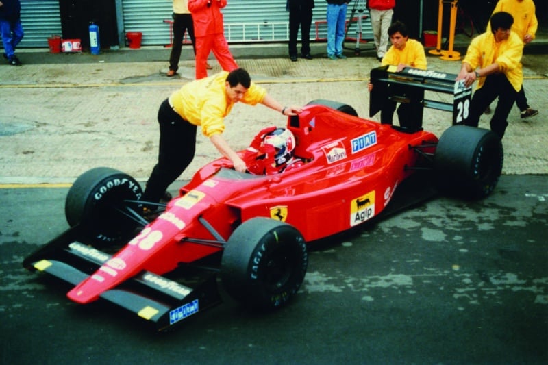 Ferrari of Gerhard Berger being pushed into the pits in 1989
