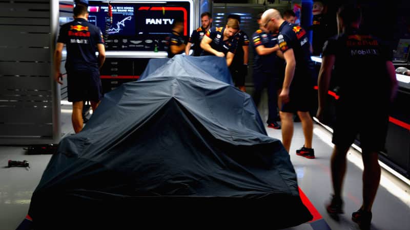 Red Bull in garage with cover