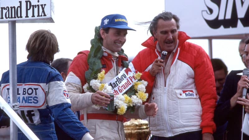 John Watson wins the British GP standing on the podium, 1981. (Photo by: GP Library/Universal Images Group via Getty Images)