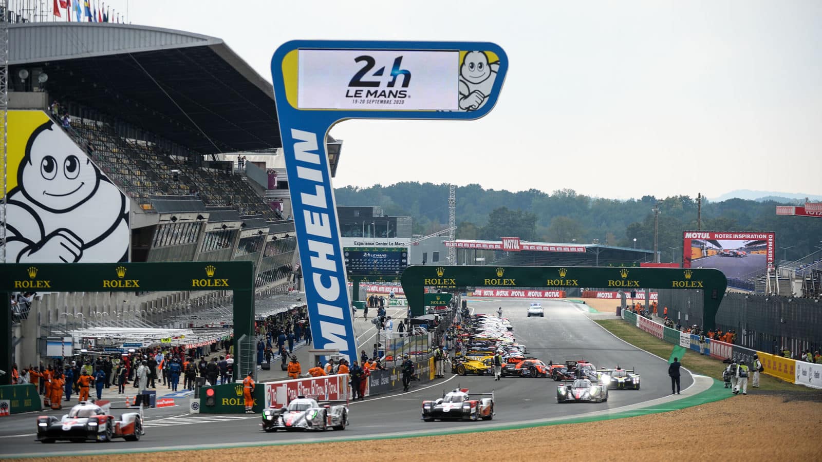 Drivers leave the pit lane for the warm up lap prior to the start of the 88th edition of the Le Mans 24 Hours race on September 19, 2020 at the La Sarthe circuit in Le Mans, in front of empty stands with Covid-19 keeping away the motorsport classic's normal crowd of 250,000 diehard fans. (Photo by JEAN-FRANCOIS MONIER / AFP) (Photo by JEAN-FRANCOIS MONIER/AFP via Getty Images)