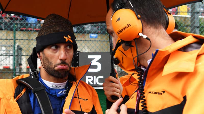 Daniel Ricciardo pokes his bottom lip out during 2021 Belgian Grand Prix rain delay