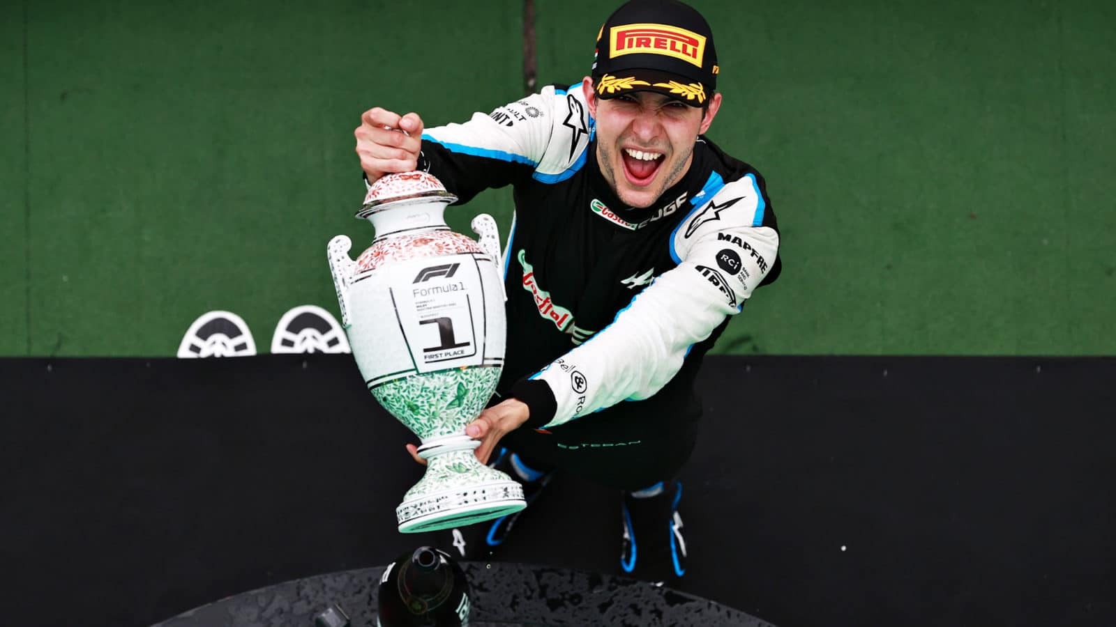 Esteban Ocon with the 2021 Hungarian Grand Prix winners trophy