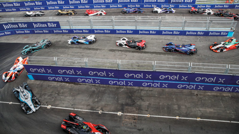 Formula E cars race through the hairpins at London Excel