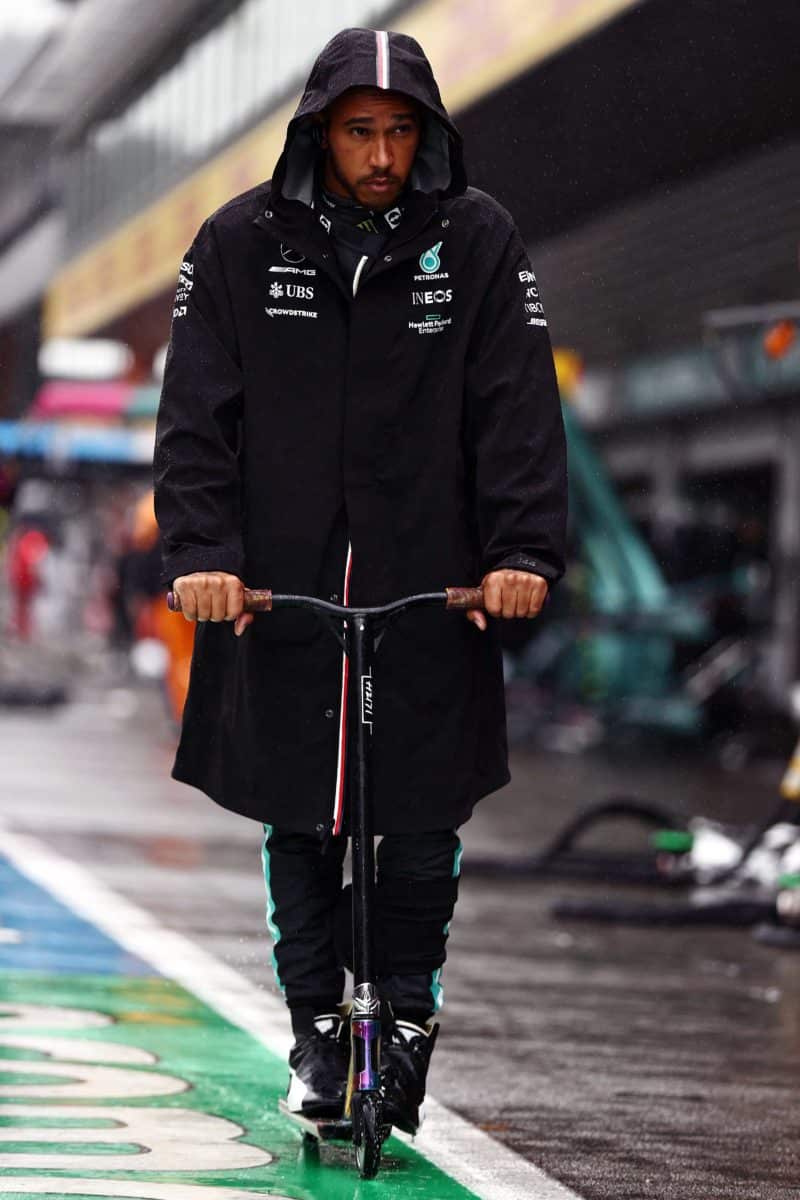 Lewis-Hamilton-on-his-scooter-in-a-wet-Spa-pitlane