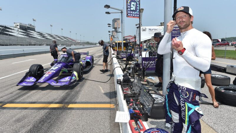 Romain Grosjean waits in the pits at the 2021 IndyCar Gateway oval test