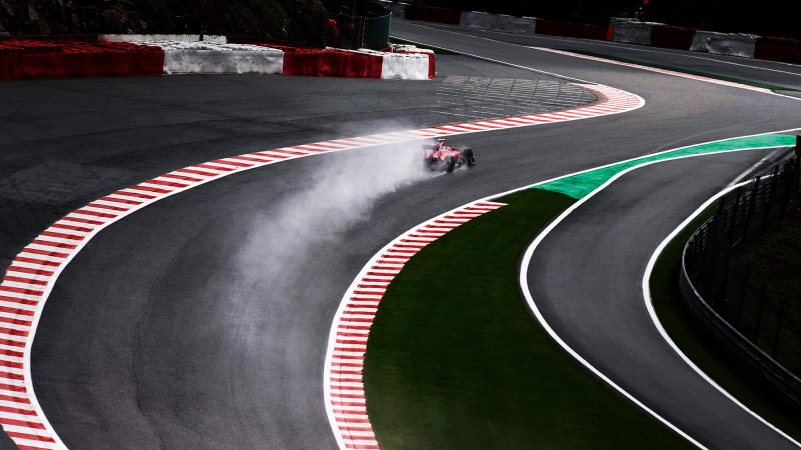 Spray from F1 car through Eau Rouge Raidillon at the Spa Belgian Grand Prix