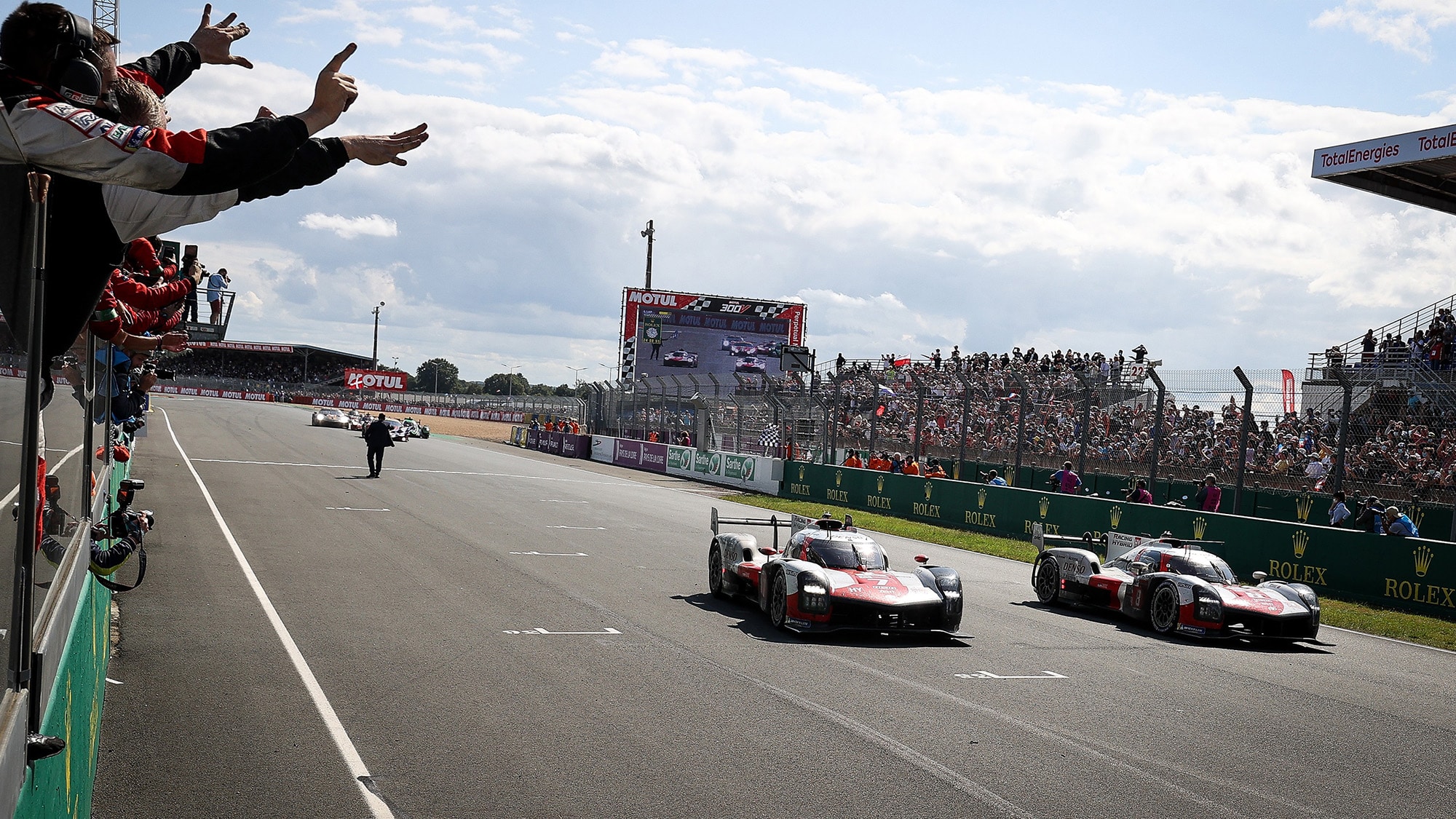 Toyotas cross the line to win the 2021 Le Mans 24 Hours