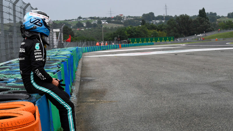 Valtteri Bottas sits on the tyre barrier after crashing out of the 2021 Hungarian Grand Prix