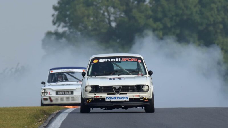 Alfasud of Keith Evans ahead of Hillman Imp on fire