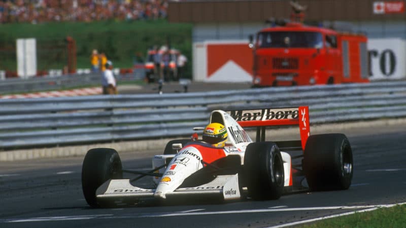 Ayrton Senna crosses the line to win the 1991 Hungarian Grand Prix