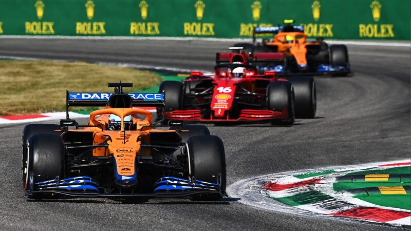 Charles Leclerc between mcLarens in the 2021 italian Grand Prix