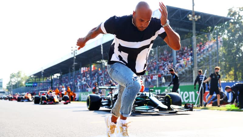 Lamont Marcell Jacobs runs om the F1 grid ahead of Monza sprint qualifying