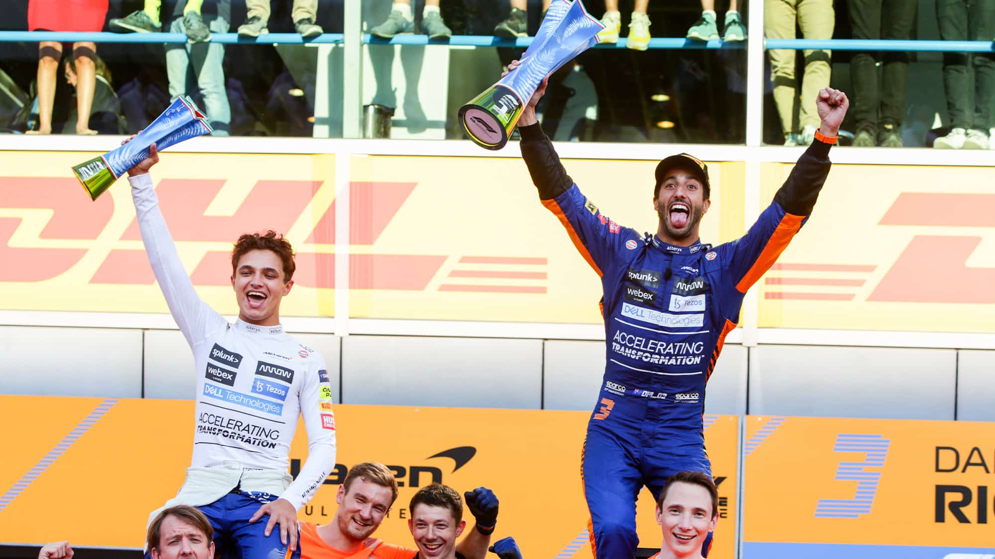 Lando Norris and Daniel Ricciardo celebrate with trophies at Monza