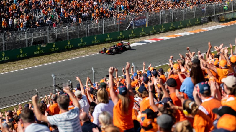 Max Verstappen drives past his orange army of fans at Zandvoort