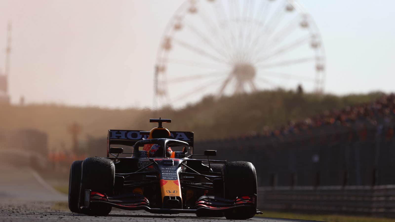 Max Verstappen drives through orange flare smoke at the 2021 Dutch GP