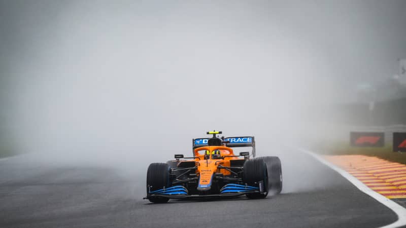 McLaren of Lando Norris generates a cloud of spray at Spa 2021